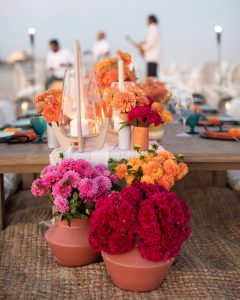 Floral decor at 40th birthday dinner on the beach in Southampton | Photo by Luis Zepeda